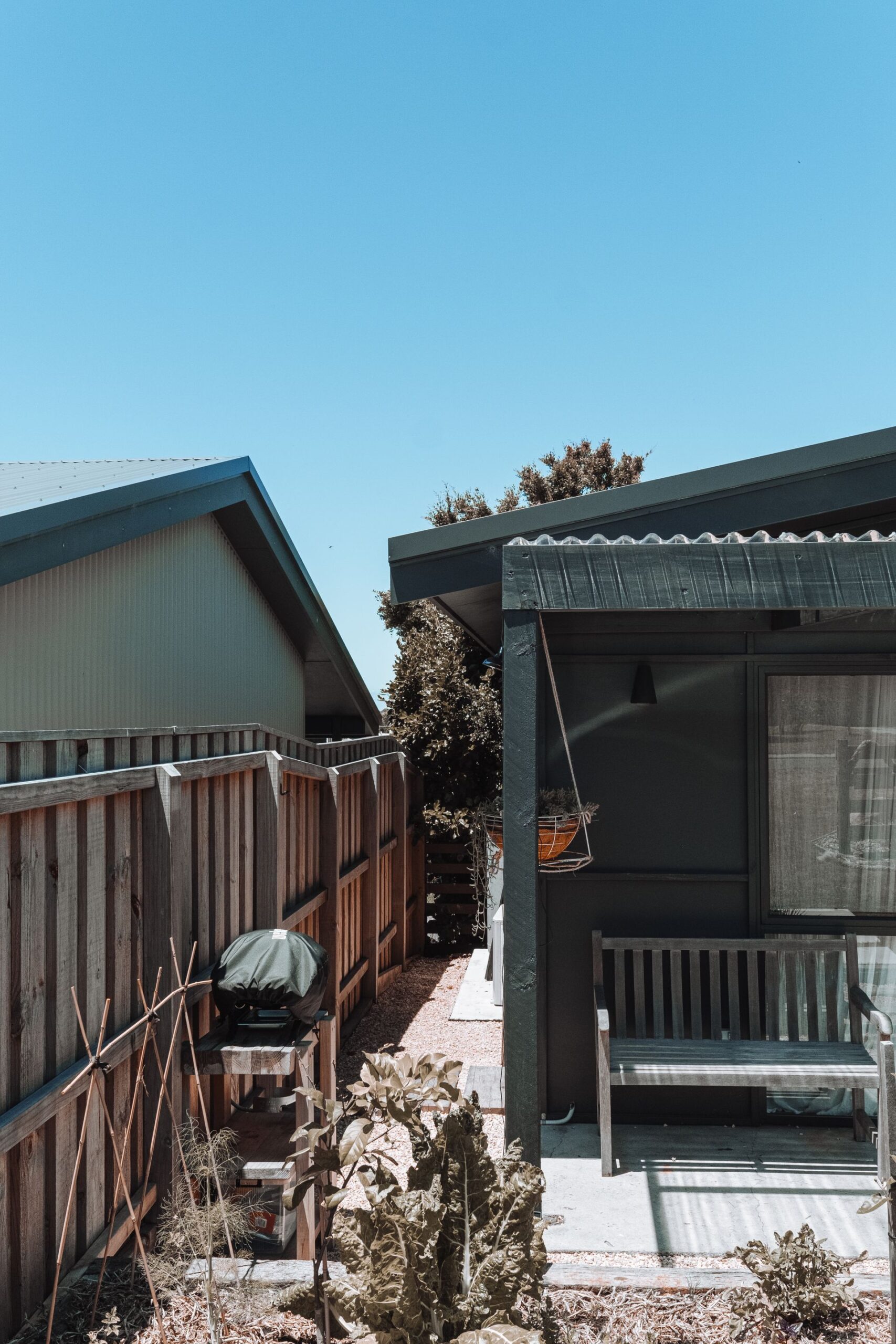Backyard of a house with wooden deck during daytime